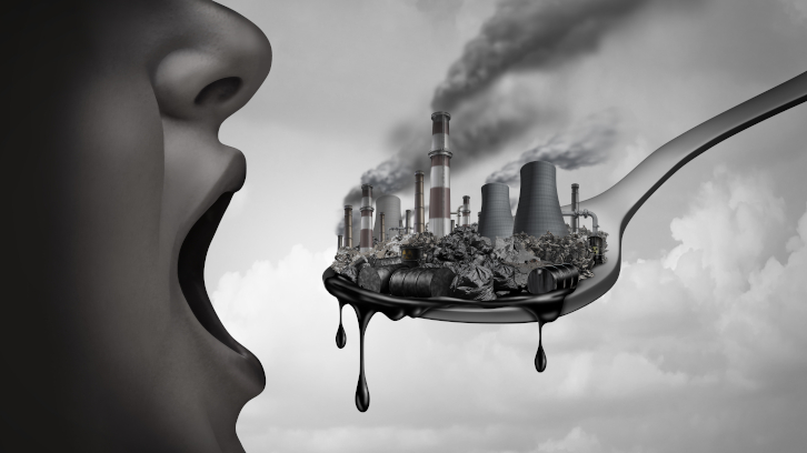 Il·lustració metafòrica d'una persona consumint contaminació.