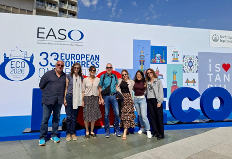 PRAP team in front of EASO congress sign