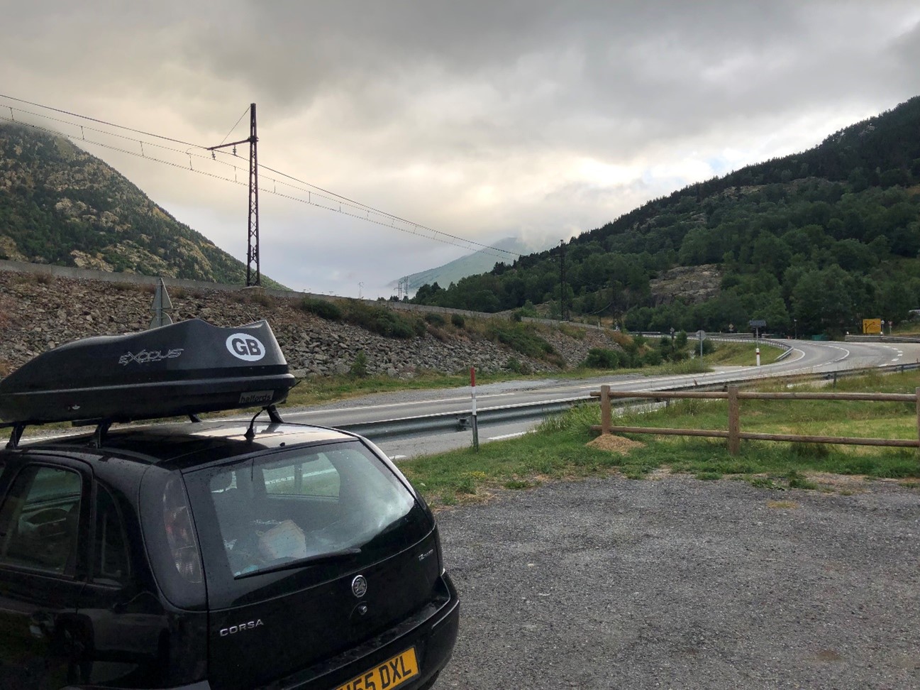 This is a partial image of a British vehicle parked in a village in the French Pyrenees