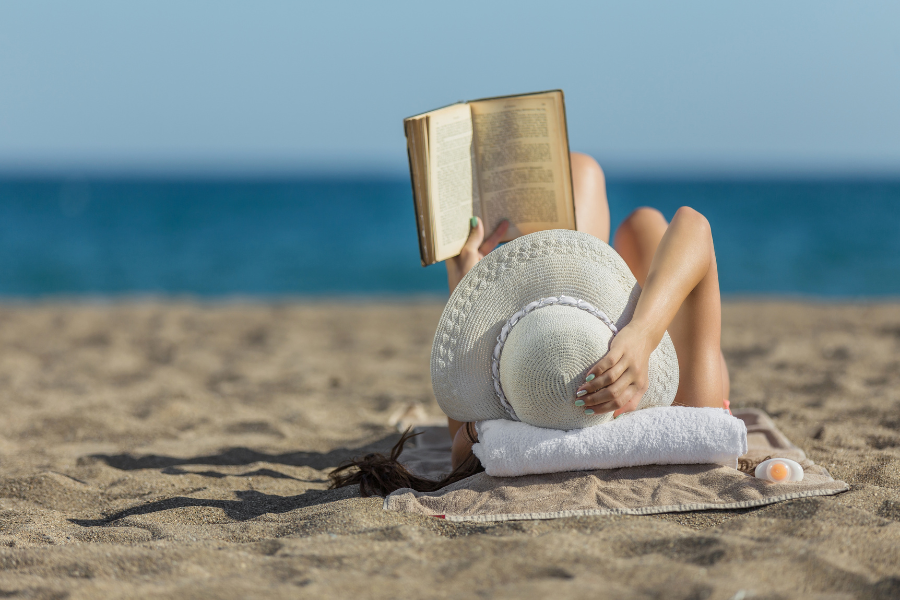 Girl reading on the beach
