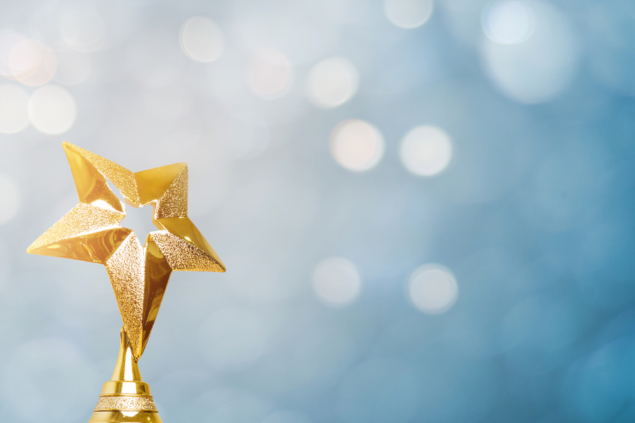 Star-shaped golden award on a blue background