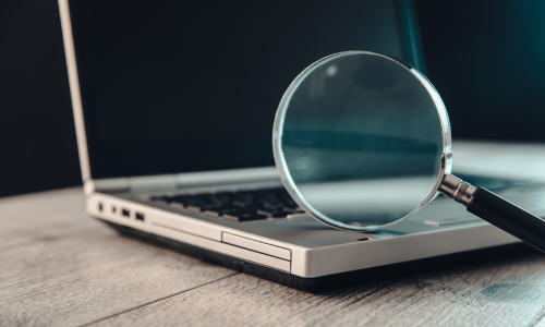 Magnifying glass on a laptop